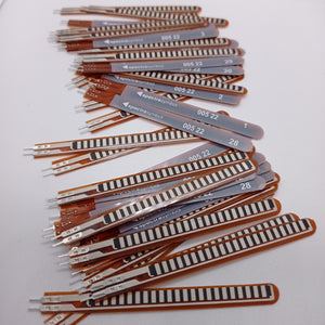 1 Piece 2.2 Inch Flex Sensor Bend Detection Sensor - shown as a large pile of thin, brown, flexible rectangular strips with metallic contact pins.