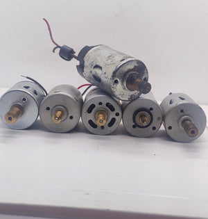 1 Piece Mix Shape DC Motor 3V To 24V Motor Without Wires - a group of six cylindrical silver DC motors with brass threaded shafts arranged on a white surface.