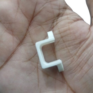 1 Piece N20 DC Gear Motor Mount Bracket - a close-up of the white plastic U-shaped mounting bracket held in a palm.