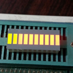 10 Segment LED Light Display Module Bar Graph Ultra Bright Red Yellow Green Colors Multi-color - ten illuminated yellow rectangular segments arranged in a horizontal bar graph on a green test socket.
