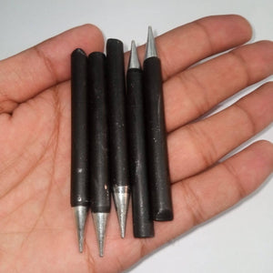 100watt Soldering Iron Bit - five black cylindrical soldering iron tips with pointed metal ends held in a hand.