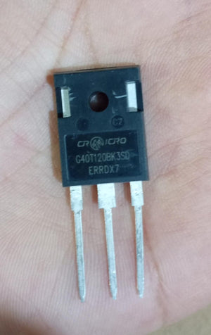 1200V 40amp G40T120 Crmicro IGBT - G40T120BK3SD IGBT, a black rectangular electronic component with three metal pins, held against a person's palm.