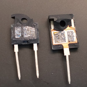 1200V 40amp G40T120 Crmicro IGBT - shown as two damaged, black electronic components with exposed internal silicon dies and metal pins.