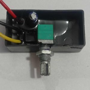 12V 5A DC Dimmer PWM - shown as a black rectangular module with a green rotary knob, three coloured wires, and an internal capacitor.