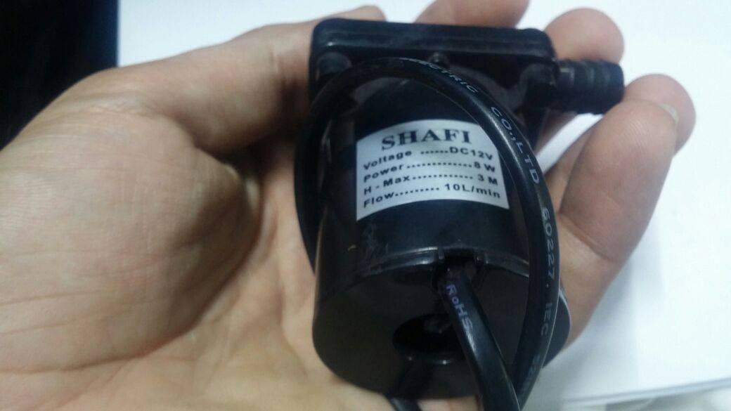 12V DC 8watt Brushless Water Pump And Solar Pump - a black cylindrical body with a label displaying voltage, power, and flow specs.