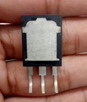 145A 650V MOSFET 145N65HS GF818 Chn - High-efficiency Power Transistor - a close-up of the back of a black electronic transistor component with three metal pins held in a hand.