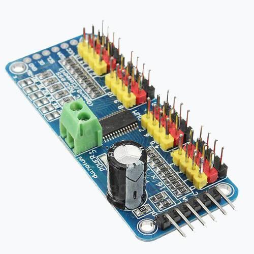 16 Channel Servo Motor Driver PCA9685 12 Bit PWM I2c Module For Arduino - a blue circuit board featuring a green screw terminal, a black capacitor, and pin headers.