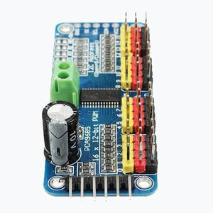 16 Channel Servo Motor Driver PCA9685 12 Bit PWM I2c Module For Arduino - a blue circuit board with a green terminal block, a black capacitor, and multiple rows of colored pin headers.