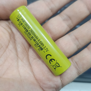 18650 1600mAh 3.7V Li-ion Rechargeable Cell For DIY Projects - a close-up of a cylindrical lime-green battery with printed technical specifications and a barcode.