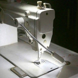 20 SMD LED Bendable Light Lamp 220V Magnetic Base Gooseneck Sewing Machine SMD Light Bulb - a white flexible gooseneck light with a magnetic base mounted on a sewing machine to illuminate the needle area.