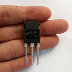 200A 750V IGBT Q200V75SDB1 SGTQ200V75SDB1-digilog.PK - a black electronic component with three metal pins, held between fingers showing the printed text Q200V7 5S2 2LES36.