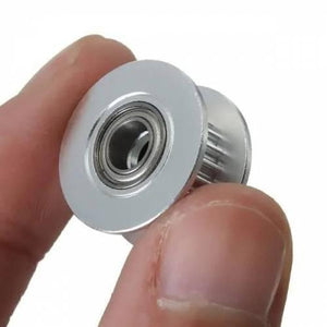 20T 5mm Bore 6mm Belt GT2 Timing Belt Idler Pulley With Bearing For 3d Printer - close-up shot of a silver metal idler pulley held between two fingers.