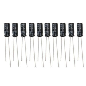 22uF 50V Electrolytic Capacitor - ten identical black cylindrical electrolytic capacitors with two wire leads each, arranged in a horizontal row.