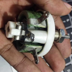 25W 1k Ohm High Power Wire Wound Potentiometer, Rheostat, Variable Resistor - a close-up showing the green wire-wound ceramic body, metal terminals, and a central rotating control shaft.