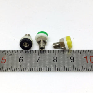 2mm Banana Female Socket Jack Connector For 2 mm Banana Plug Test - three units with black, green, and yellow caps placed on a metal ruler for scale.