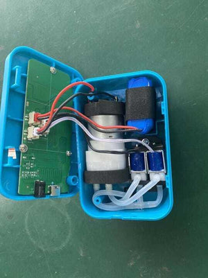 3.7V 2400mA Li Ion Battery Pack 40mm x 30mm x 20mm - shown inside an open blue plastic casing with a circuit board, motor, and tubing connected.