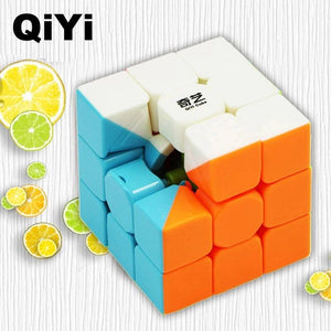 3 By 3 Rubik Cube 3x3 - a partially disassembled white, blue, and orange plastic puzzle cube with a Qiyi brand logo on a white wooden background.