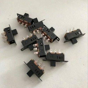 3 Pole 3 Position Slide Switch 6 Pin Lever Switch Handle High Miniature - collection of black miniature slide switches with six metal pins and a sliding lever handle arranged on a white surface.