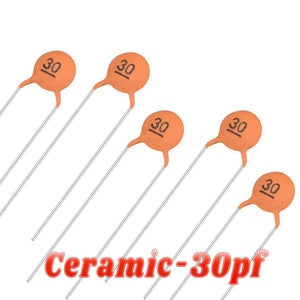 30pF Ceramic Capacitor - five small, round, orange-coloured disc capacitors with two metal leads each, arranged on a white background.