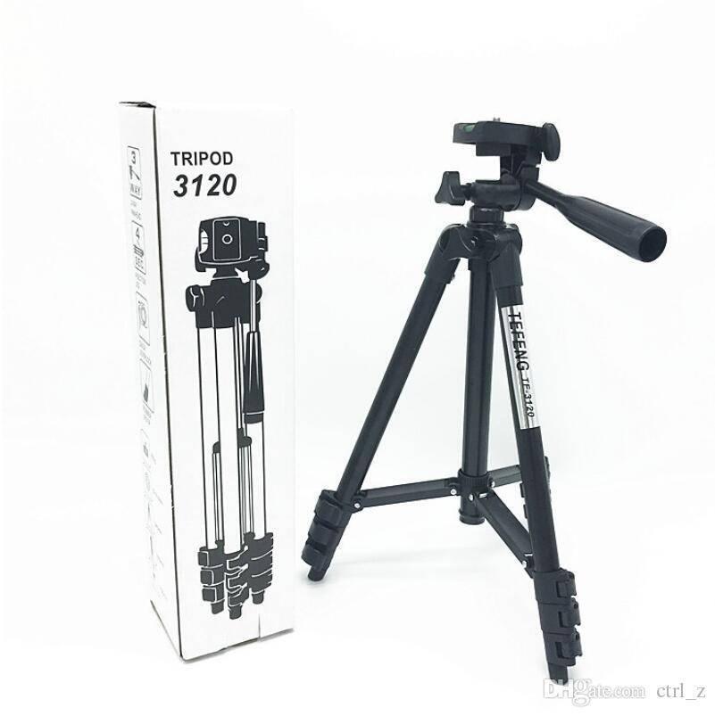 3120 Adjustable Tripod Stand With Mobile Holder For Camera And Phones - with its white retail box, featuring a black three-legged stand with a pan-tilt head, handle, and leg locks.