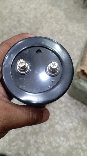 3300µF 500V Electrolytic Capacitor price - a close-up view of the black circular top featuring two threaded screw terminals marked with positive and negative signs.