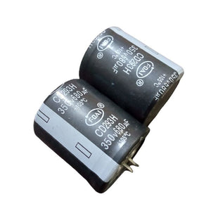 350V 680uF Capacitor - two black cylindrical electrolytic capacitors with snap-in terminals, each printed with 350V, 680µF, and +105°C ratings.
