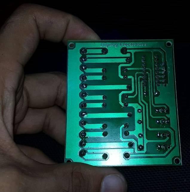 4 Channel Relay Module Relay Board Arduino Relay Module - the green rectangular printed circuit board (PCB) from the underside, featuring soldered pins and copper traces.