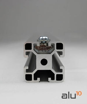 40XM8 T Nut Sliding T Nut Hammer Drop In Nut Fasten Connector M8 Series - shown inserted into the slot of a silver aluminum profile extrusion.
