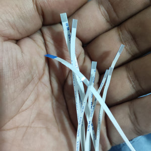 5 Pin Fpc Cable 0.5mm Pitch - shown as a close-up of several white, flexible flat ribbon cables held in a hand.