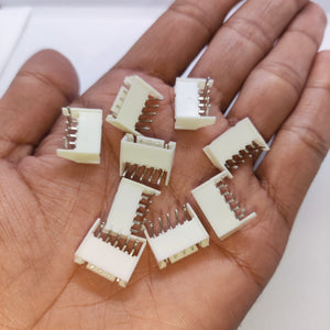 5 Pin Right Angle Male 2.5mm JST Xh Style PCB Mount Connector - shown as a collection of white plastic connectors held in a person's hand.
