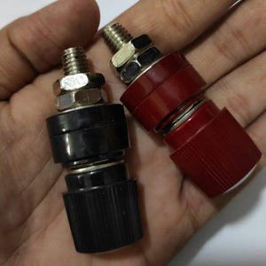555 Black Red Terminal M8 Blocks Power Supply Terminals Welding Machine Inverter Post Connector - a close-up of one black and one red threaded power supply terminal connector held in a hand.