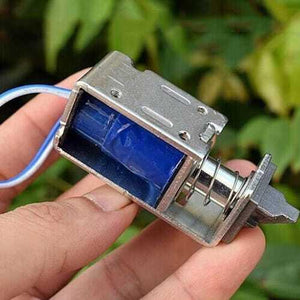 5V-7.4V DC Mini Electromagnet Solenoid Door Lock - a metallic frame, a blue coil, a spring-loaded plunger, and two blue and white electrical wires.