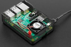 5V Raspberry Pi 4 Fan - installed inside a transparent black plastic case on a Raspberry Pi board with a connected power cable.