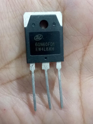 60N60FD1 MOSFET - 600V 60A N-channel Power Transistor - a black three-pin electronic power transistor held in a hand, showing the printed model number and specifications on its front face.