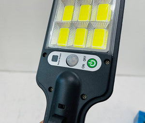 616-4 Motion Sensor Street Lamp - the black plastic housing, six LED panels, a sensor receptor, a motion sensor, and an ON/OFF button.