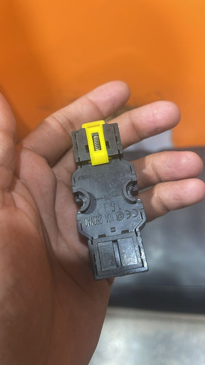 8 Pin Relay Socket Base Thick Copper 10A Mini Relay Socket Base - shown as a close-up of a black plastic relay base with a yellow spring-loaded clip held in a hand.