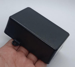 87mm x 55mm X33MM ABS Box PCB Enclosure Plastic Box Project Box - a rectangular black plastic project box with a mounting tab held in a hand.