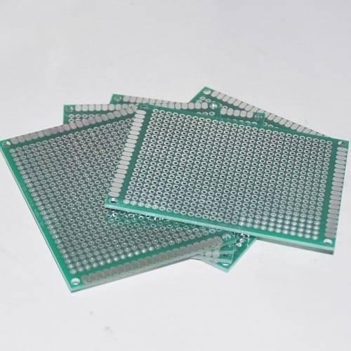 8x12cm Single Side Fiberglass PCB Veroboard Stripboard Circuit Project Board - a stack of green rectangular circuit boards with rows of holes.