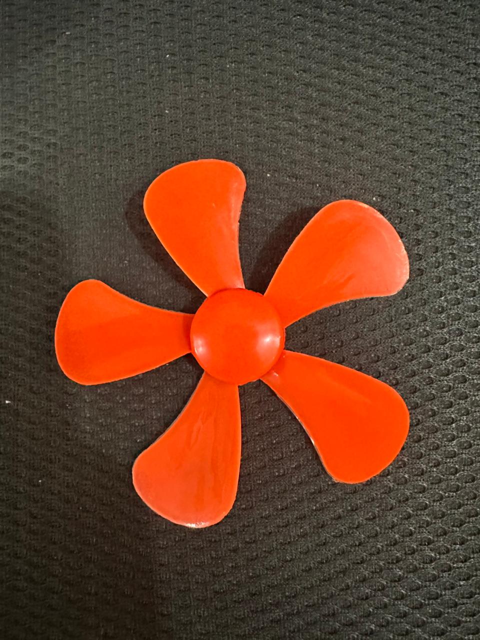 98mm DIY Blade Propeller Plastic Fan For Mini DC Toy Motor - shown as a five-bladed, bright orange plastic propeller fan on a dark textured background.