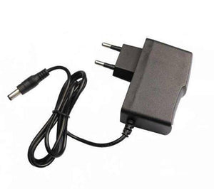 9V 3A Power Supply Adapter - a black rectangular wall-plug unit with two prongs and a black cable ending in a cylindrical barrel connector.