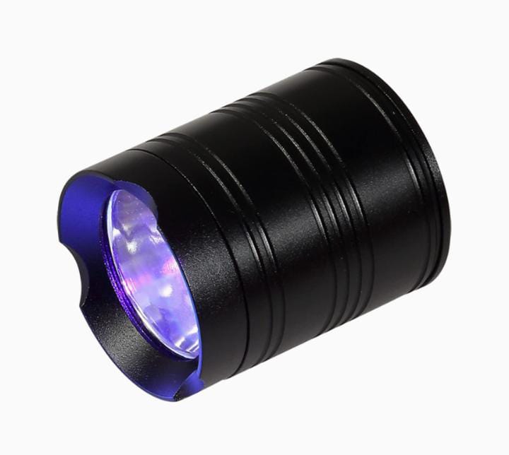 Koocu KC-UV1 Smart Curing UV Lamp Light - a black, cylindrical handheld UV flashlight with a purple-tinted lens and a scalloped bezel.