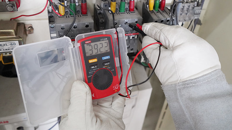 UNI-T UT120B pocket multimeter measuring voltage in use
