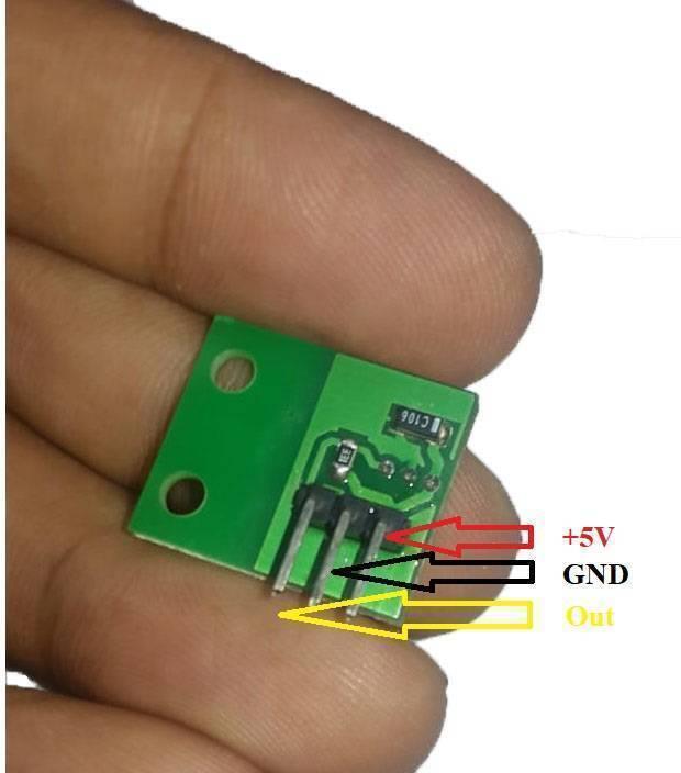 A1104E A04E New Original Hall Monopole Switch Small Volume TO-92uA - green circuit board with a three-pin connector held by fingers, labeled with +5V, GND, and Out arrows.