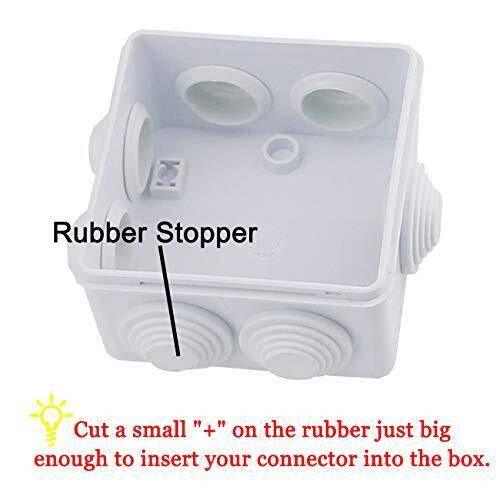 ABS Plastic Junction Box Universal Electrical Project Enclosure 100x100x65mm - shown as a white square enclosure with rubber stoppers on the sides and instructional text for cable insertion.