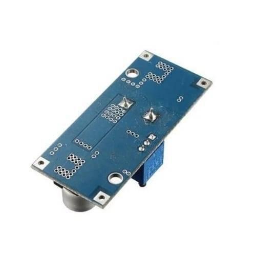Adjustable DC To DC Step Down 5A Buck Converter With Heatsink XL4015 - the blue rectangular circuit board from the back with a metal potentiometer.