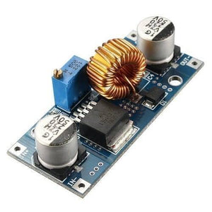 Adjustable DC To DC Step Down 5A Buck Converter With Heatsink XL4015 - blue circuit board featuring a copper inductor, two capacitors, and a knob.