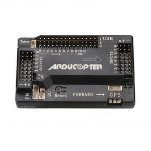 APM2.8 Multicopter Flight Controller - a rectangular black module featuring labeled ports for GPS, telemetry, power, inputs, outputs, and a reset button.