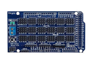 Arduino Mega Sensor Shield - a blue rectangular circuit board featuring numerous pin headers, a reset button, a terminal block, and various labeled ports.