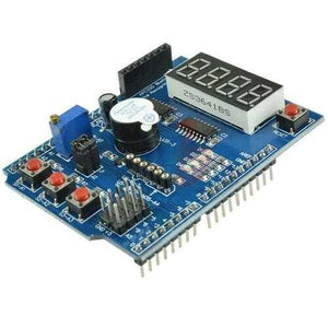 Arduino Multifunctional Expansion Board Shield Kit - a blue PCB with a four-digit seven-segment display, four push buttons, and a buzzer.
