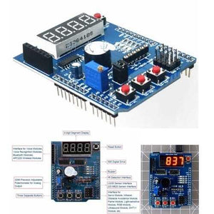 Arduino Multifunctional Expansion Board Shield Kit - a blue circuit board with a 4-digit display, three buttons, a buzzer, and various ports.
